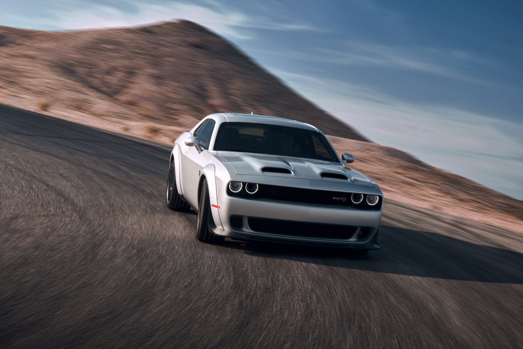 Dodge Challenger driving on a race track