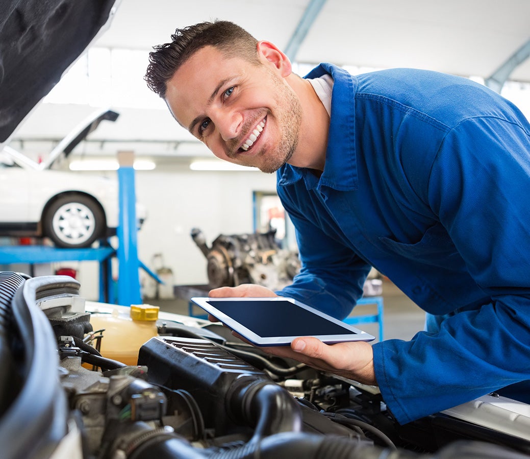 A man inspecting a car